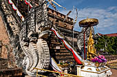 Chiang Mai - The Wat Chedi Luang. The massive chedi heavily damaged by an earthquake. The four staircases are protected by recentely restored guardian naga. 